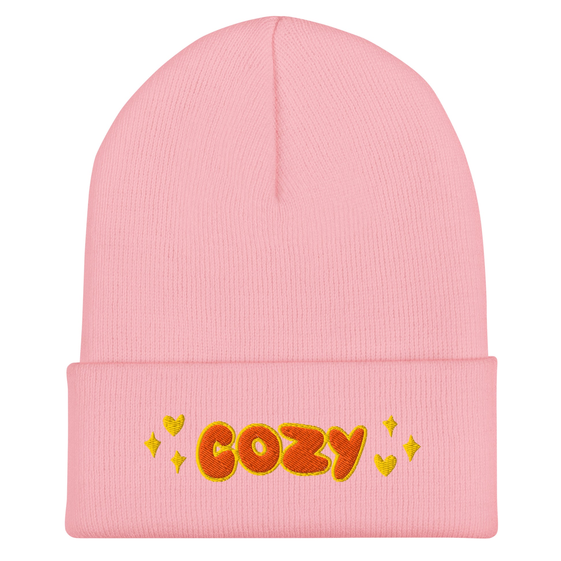 pink beaie that says cozy in orange bubble letters