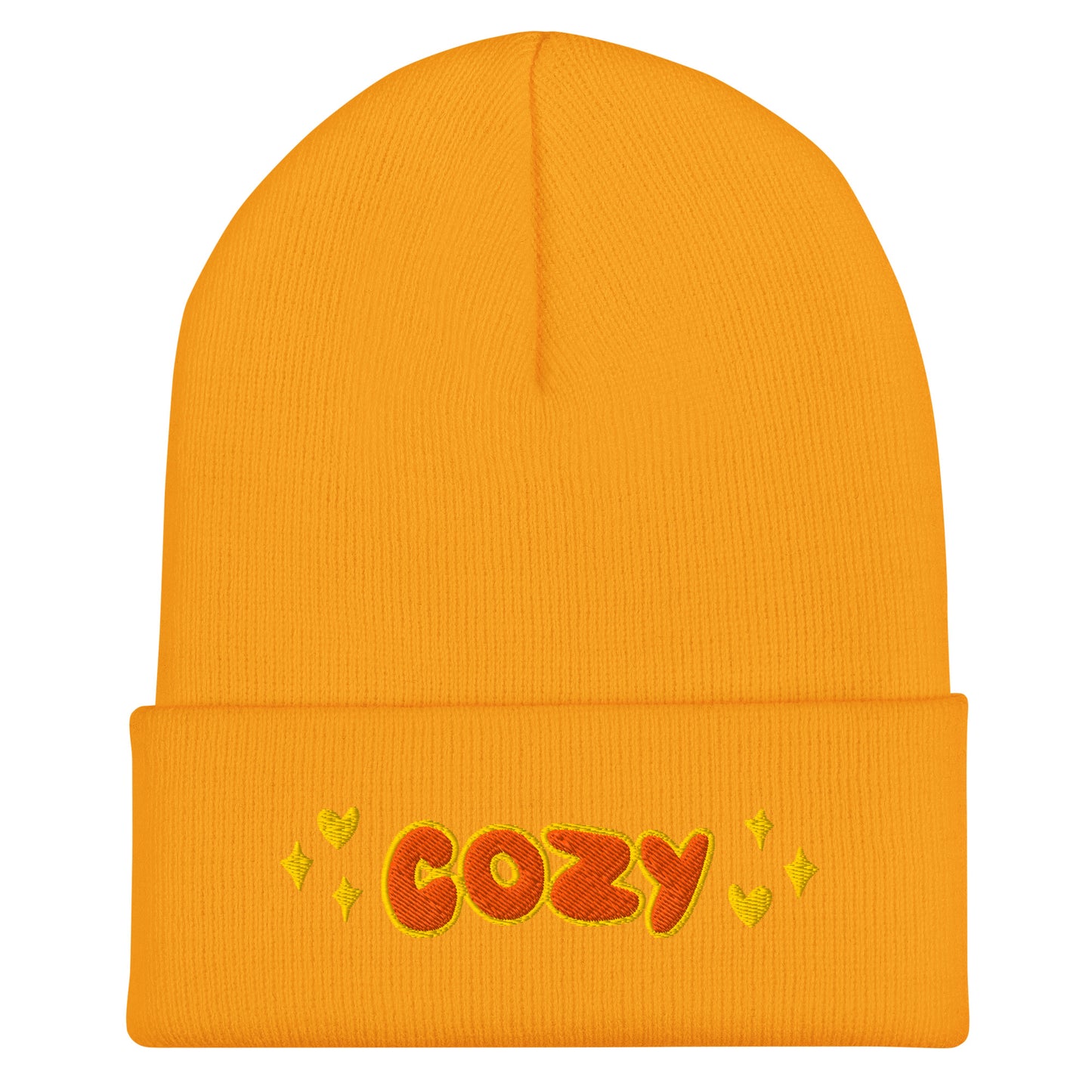 yellow beanie with the word cozy embroidered in orange with hearts and stars details on either side of the text