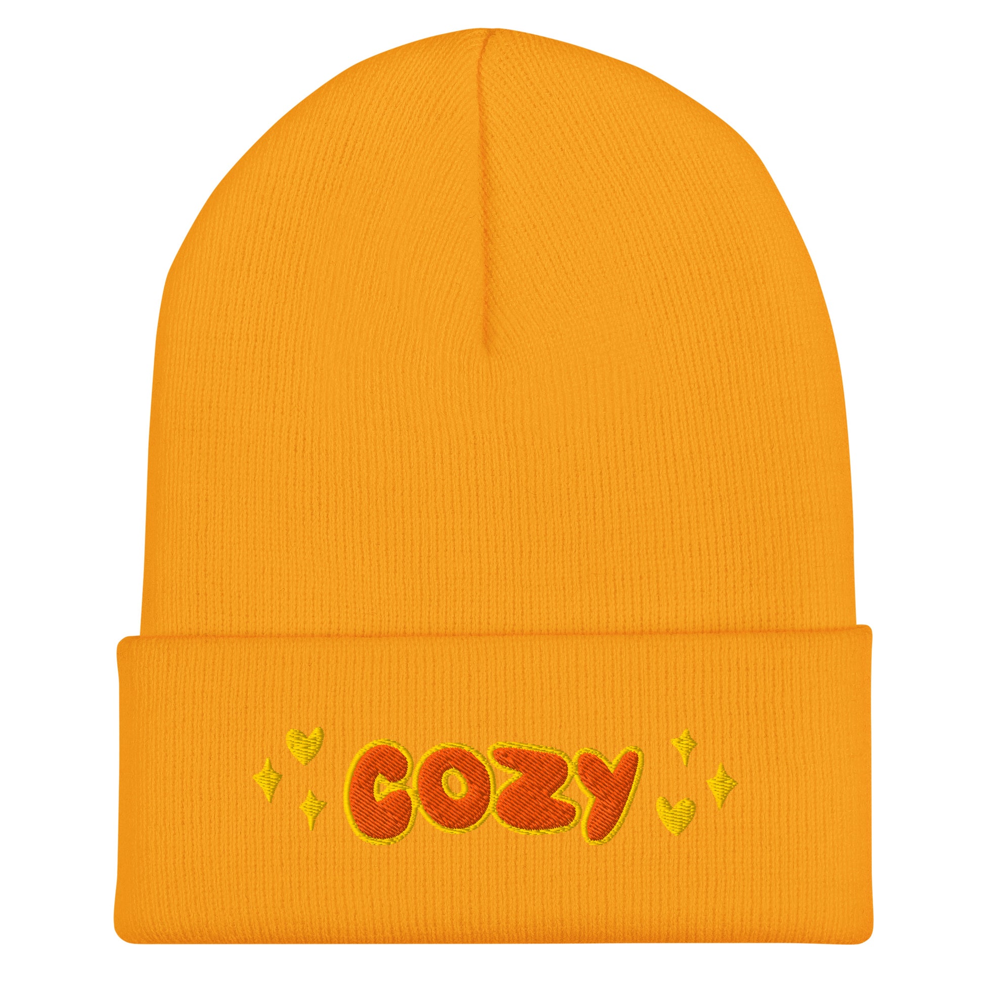 yellow beanie with the word cozy embroidered in orange with hearts and stars details on either side of the text